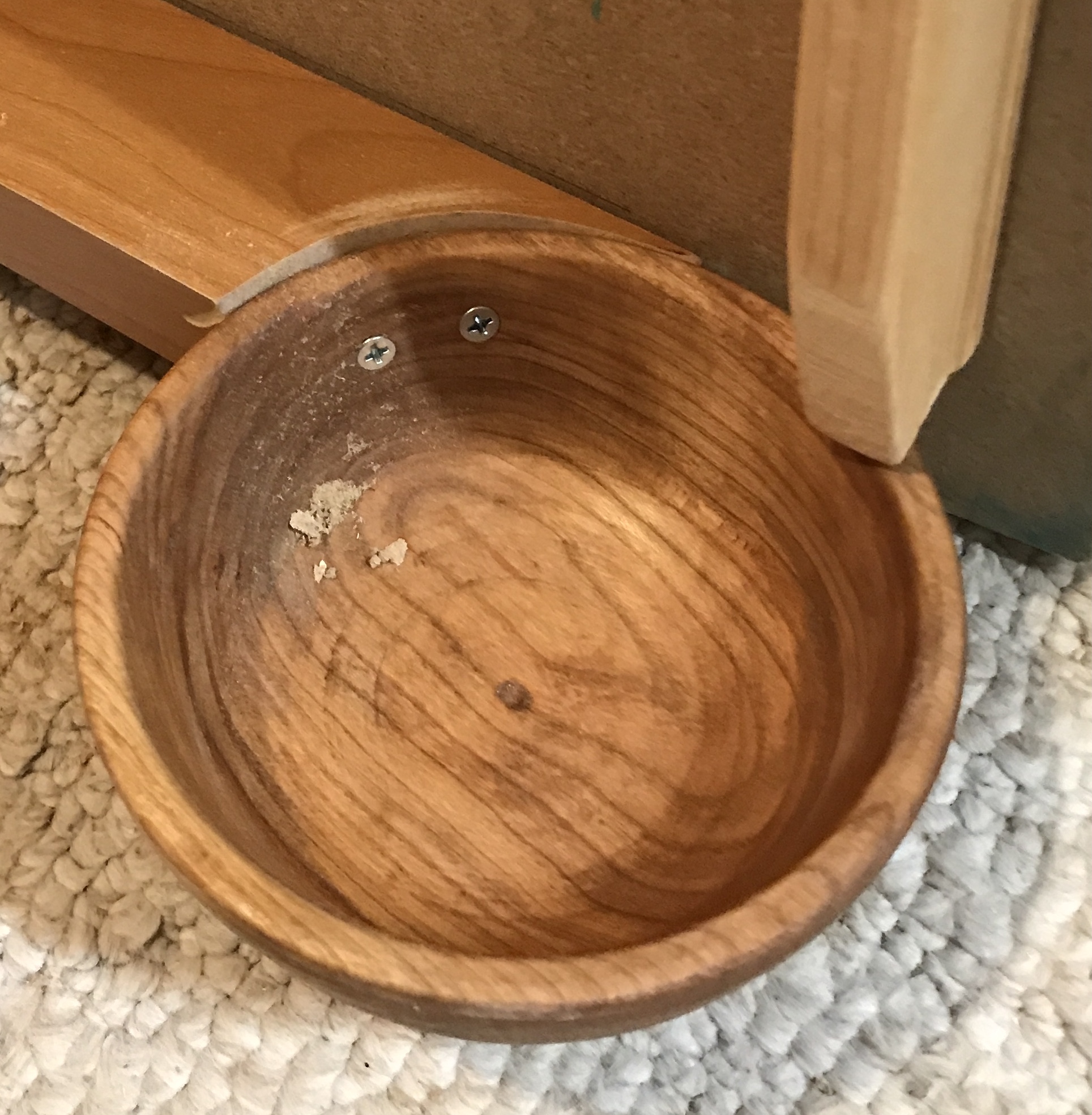 The bowl attached to the return with screws